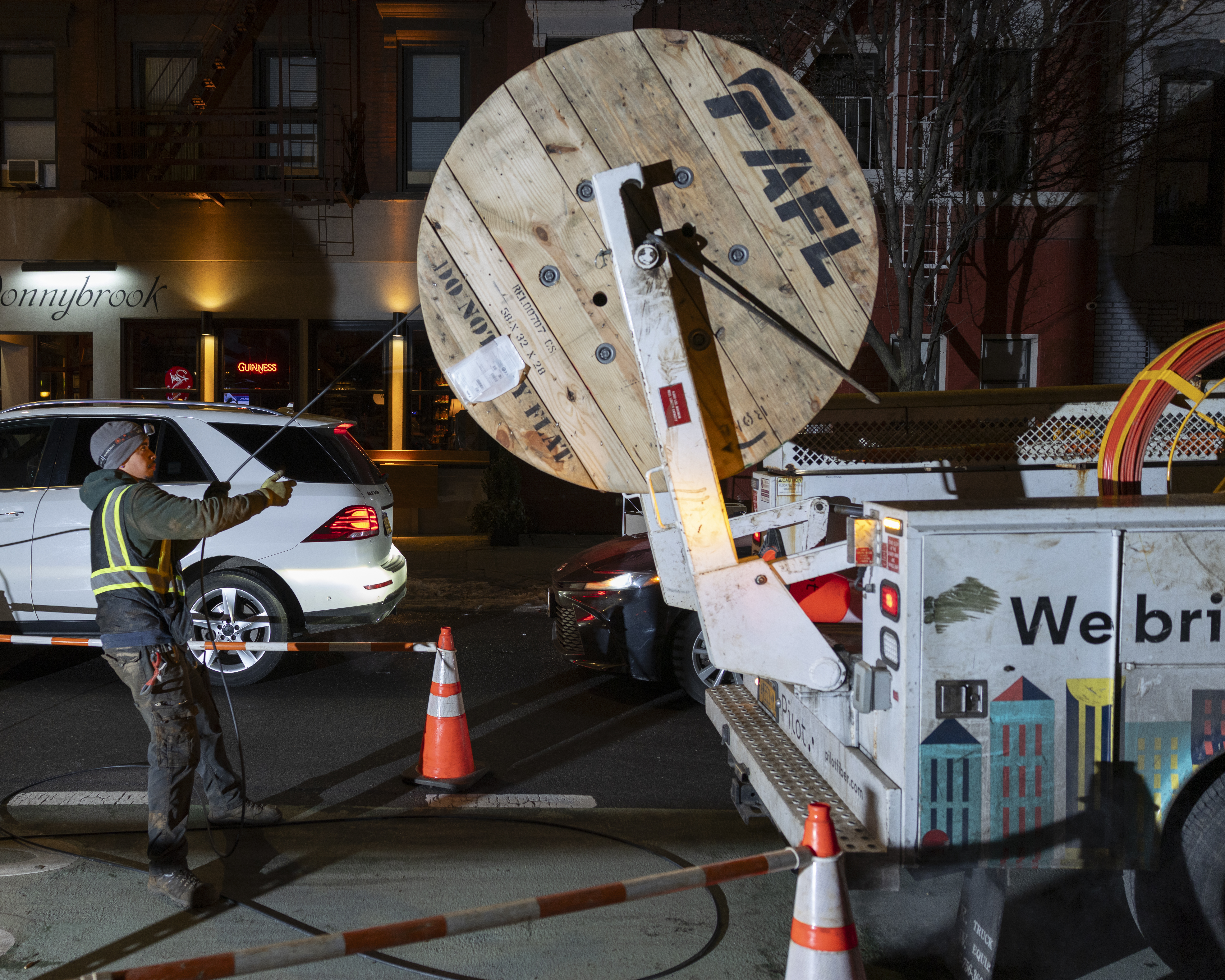 Fibre optic cable being deployed from a reel truck